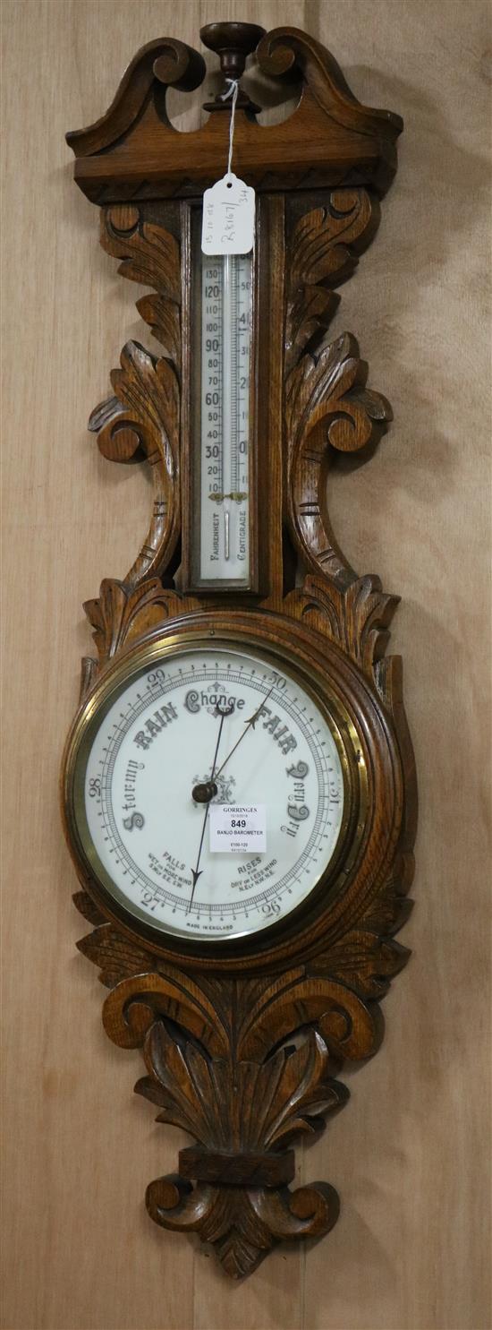 An Edwardian oak banjo barometer W.25cm